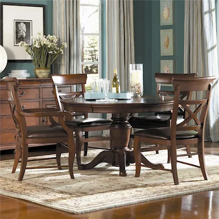 Round Pedestal Table with Arm and Side Chairs
